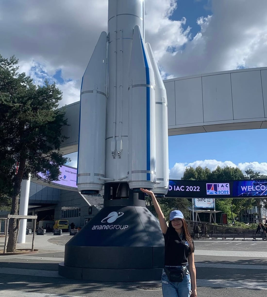 Verónica Chinchilla next to the Ariane rocket replica at the International Astronautical Congress 2022 in Paris
